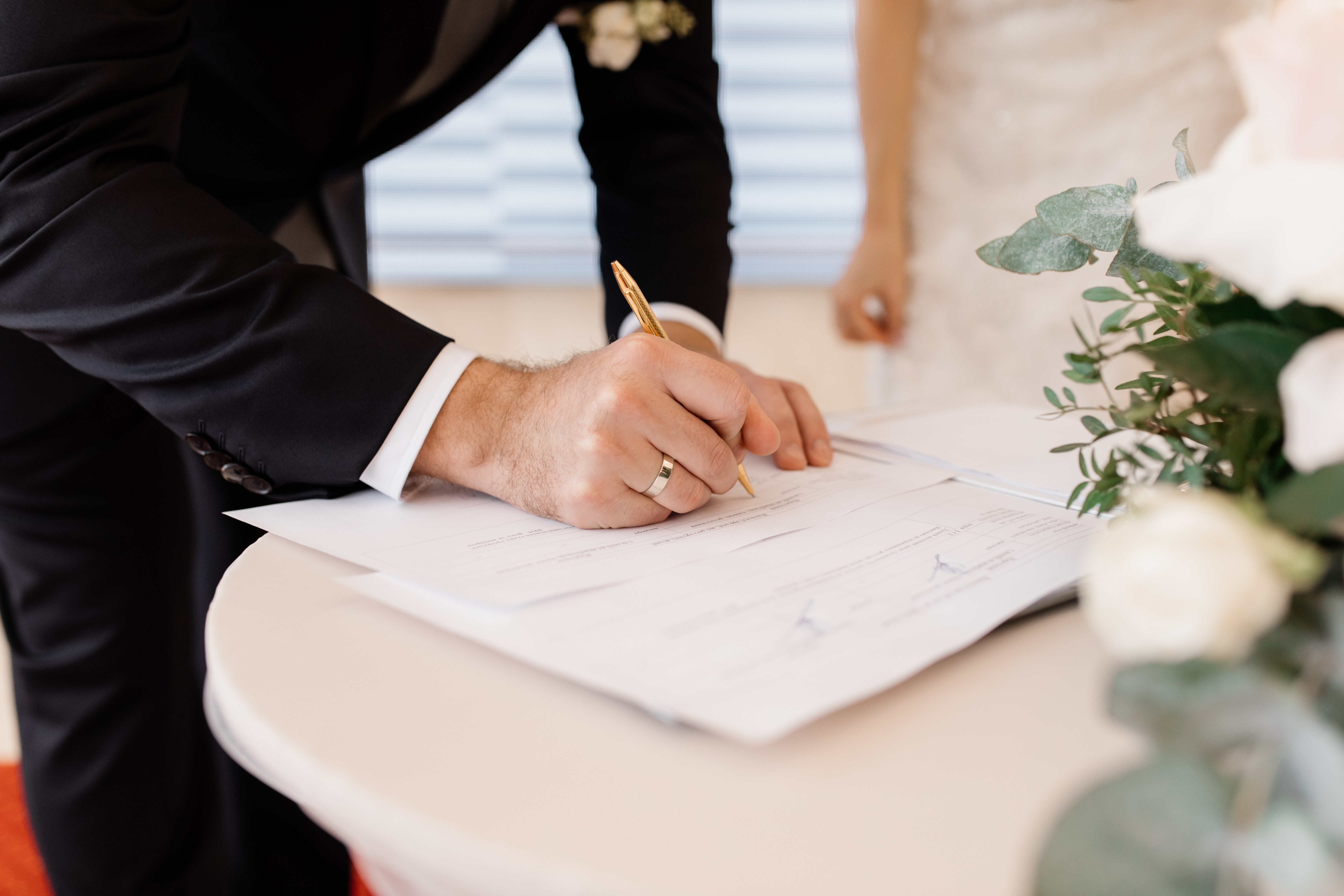 couple-in-love-is-signing-official-marriage-documents.jpg